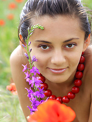 Sima enjoys a relaxing weekend,   sunbathing among the flowery fields for   her debut series.