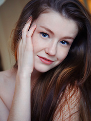 Strikingly beautiful in white lingerie with a red satin ribbon Emily Bloom knows just how to tease and please you