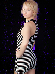 Feeona A posing in her boy-hugging dress before sprawling sensually on the cold, damp floor.