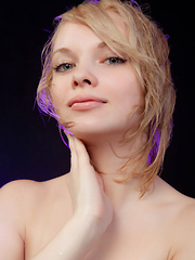 Feeona A posing in her boy-hugging dress before sprawling sensually on the cold, damp floor.