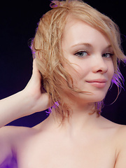 Feeona A posing in her boy-hugging dress before sprawling sensually on the cold, damp floor.