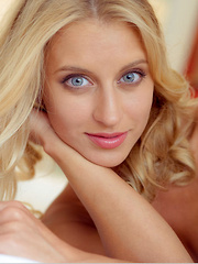 Blonde hottie Delfina A wearing an animal print chiffon robe and sheer panty that compliments her beautiful tanned body and lusty appeal.