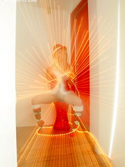 Kara in her sexy christmas outfit wrapped in lights spreading her pussy