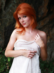 Stunning redhead Mia Sollis flaunts her perfect body and puffy nipples outside.